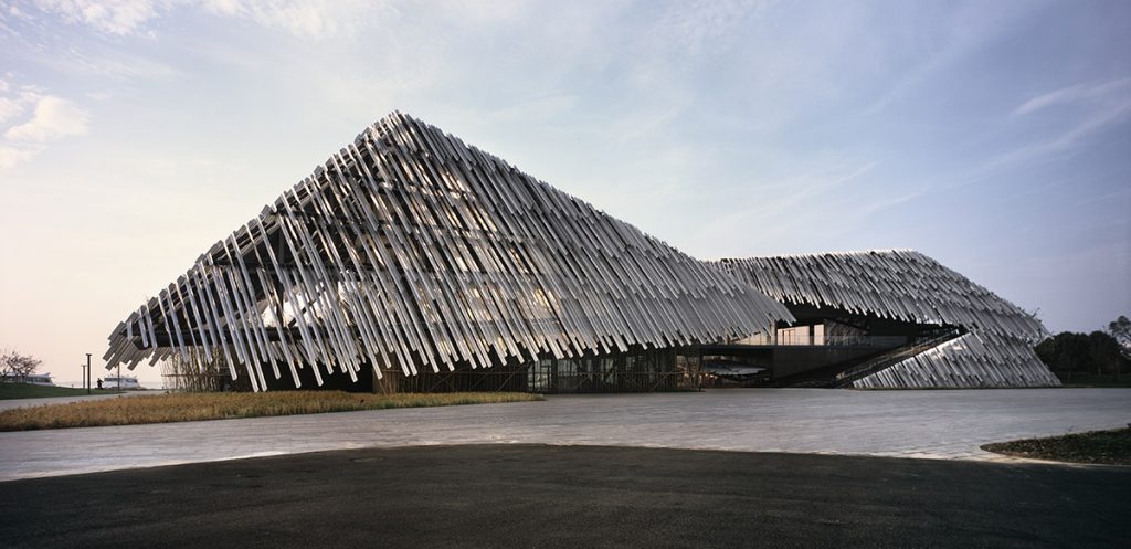 Kengo Kuma tourist transportation center on a waterfront in Xiangcheng District of Suzhou, China.